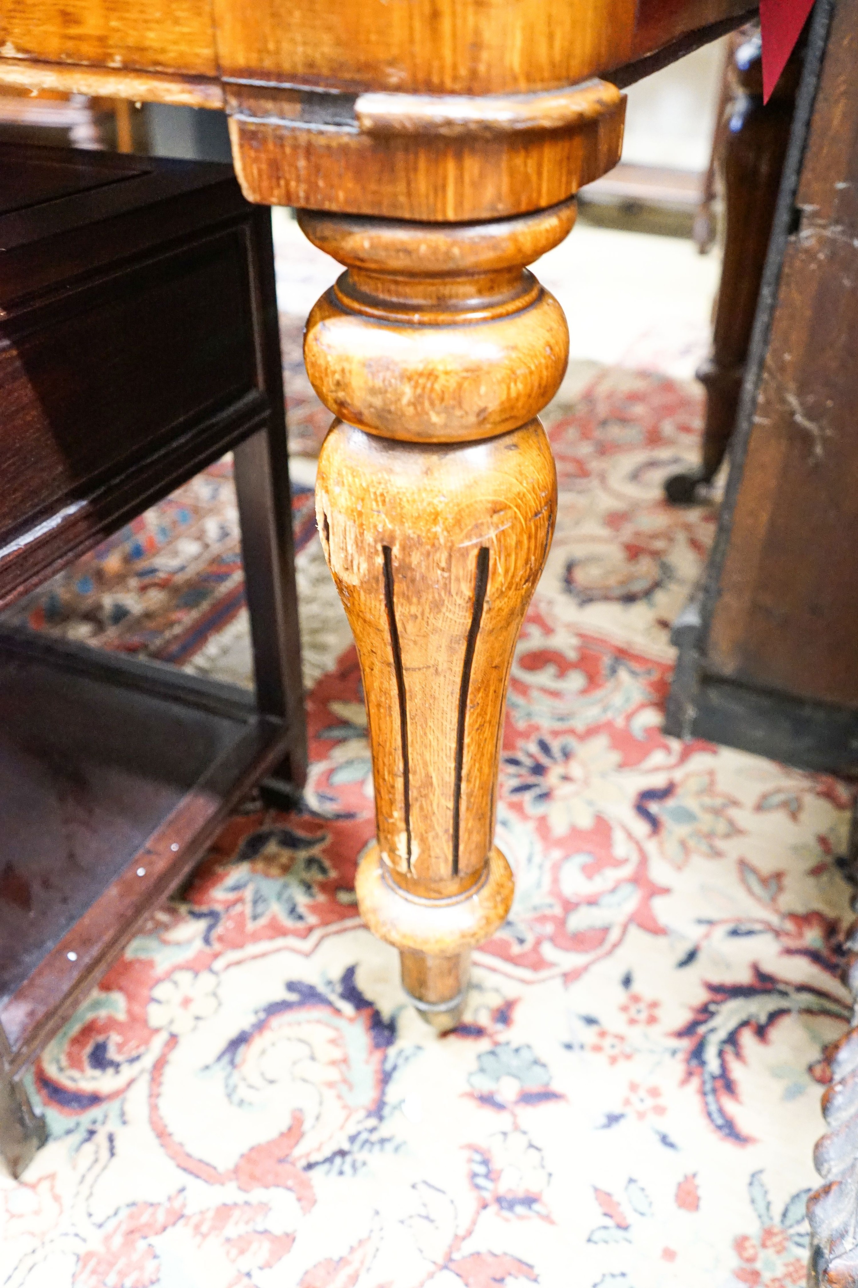 An early Victorian oak library table fitted two end drawers, from the Library of The Royal College of Surgeons, London, width 196cm, depth 105cm, height 76cm